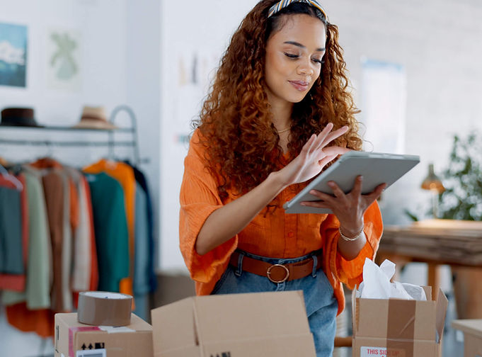 Business owner using tablet in a retail setting