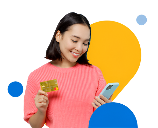 Woman smiling while holding a credit card and a mobile phone